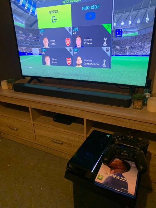 Playstation 4 Console with 2 controllers and fifa 2022.. everything is working