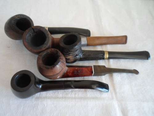 A COLLECTION OF 5 WELL USED ESTATE SMOKING PIPES
