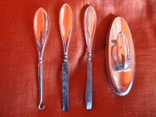 FOUR PIECE SILVER HANDLED MANICURE SET