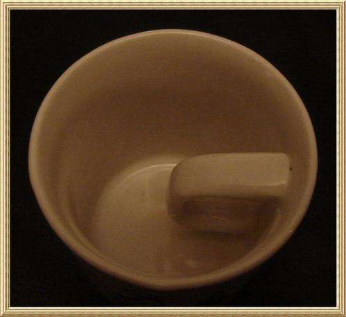Grahamstown Potteries " A Genuine van der Merwe Mug " handle with in the mug from Blisful