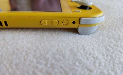 Nintendo Switch lite, charger and original packaging one digital game animal crossing new horizon