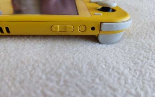 Nintendo Switch lite, charger and original packaging one digital game animal crossing new horizon