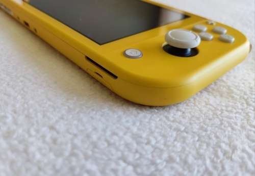 Nintendo Switch lite, charger and original packaging one digital game animal crossing new horizon