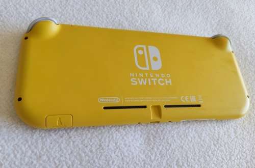Nintendo Switch lite, charger and original packaging one digital game animal crossing new horizon