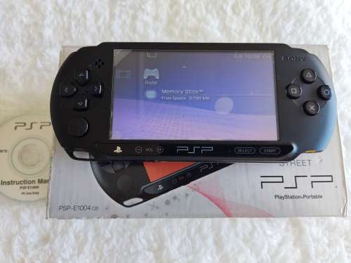 Sony psp sreet (Psp - E1004) charcoal black console with original packaging and games bundle