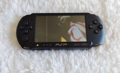 Sony psp sreet (Psp - E1004) charcoal black console with original packaging and games bundle
