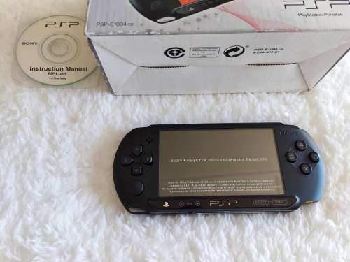 Sony psp sreet (Psp - E1004) charcoal black console with original packaging and games bundle