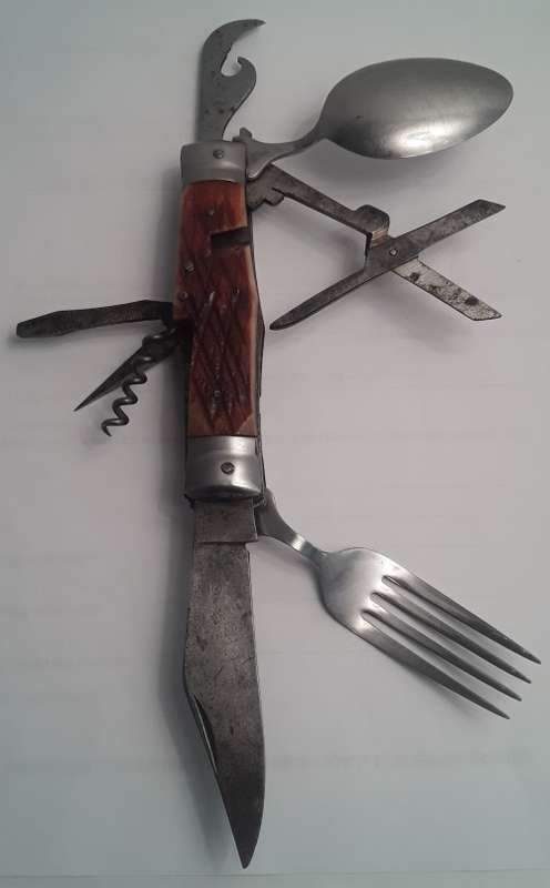 A  vintage multi-tool utility knife with original pouch.  Awesome!!!