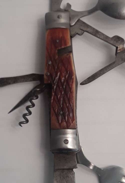 A  vintage multi-tool utility knife with original pouch.  Awesome!!!