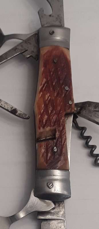 A  vintage multi-tool utility knife with original pouch.  Awesome!!!