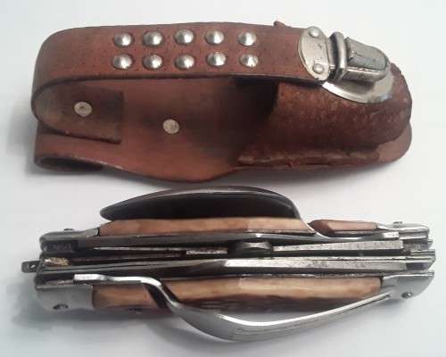 A  vintage multi-tool utility knife with original pouch.  Awesome!!!