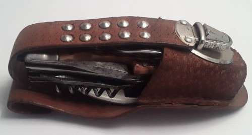 A  vintage multi-tool utility knife with original pouch.  Awesome!!!