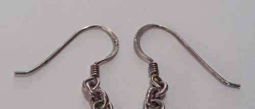 A gorgeous pair of solid silver earrings with flower motif.  Superb!!!