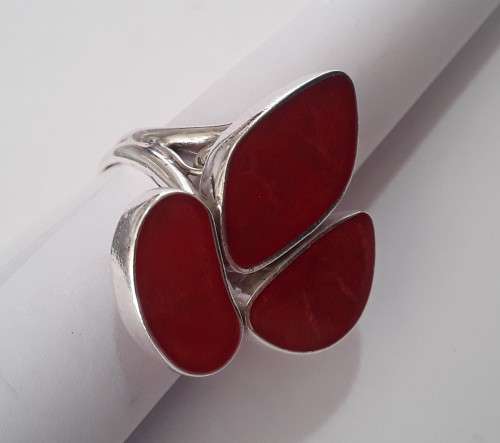 A beautifully designed, sterling silver ring with stunning red stones.  Wow!!!