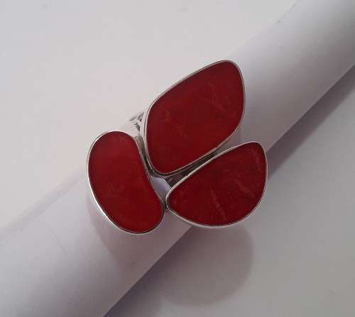 A beautifully designed, sterling silver ring with stunning red stones.  Wow!!!