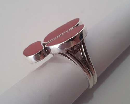 A beautifully designed, sterling silver ring with stunning red stones.  Wow!!!