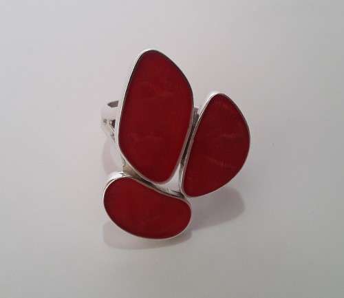 A beautifully designed, sterling silver ring with stunning red stones.  Wow!!!