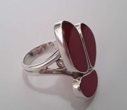 A beautifully designed, sterling silver ring with stunning red stones.  Wow!!!