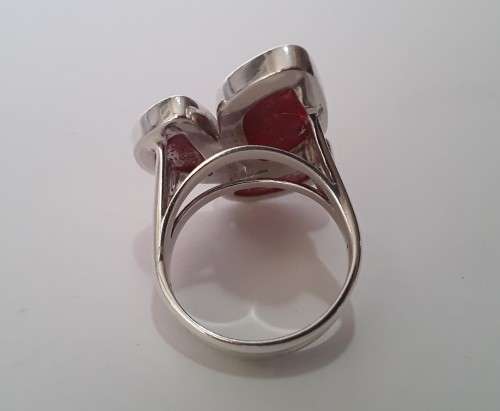 A beautifully designed, sterling silver ring with stunning red stones.  Wow!!!