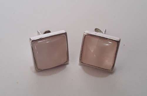 A designer pair of solid sterling silver earrings with blushing pink stones. Dainty and gorgeous!