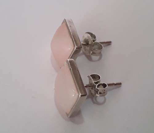 A designer pair of solid sterling silver earrings with blushing pink stones. Dainty and gorgeous!
