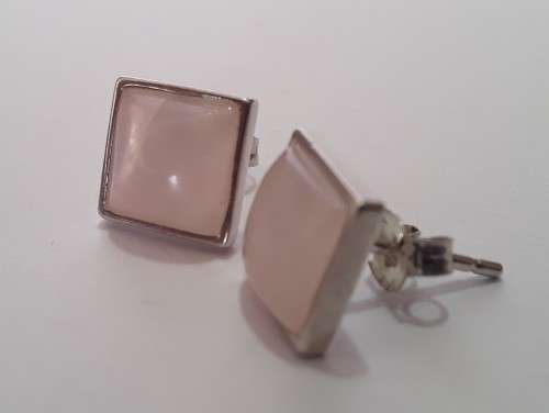 A designer pair of solid sterling silver earrings with blushing pink stones. Dainty and gorgeous!