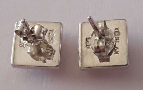 A designer pair of solid sterling silver earrings with blushing pink stones. Dainty and gorgeous!