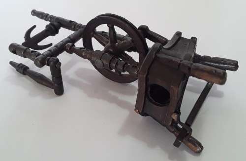A vintage, collectable metal spinning wheel pencil sharpener.