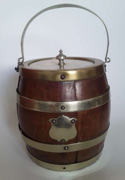 Antique oak tobacco jar in the form of a French wine barrel.  Ceramic interior.