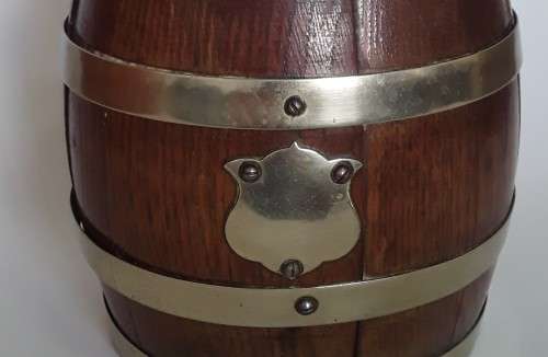 Antique oak tobacco jar in the form of a French wine barrel.  Ceramic interior.