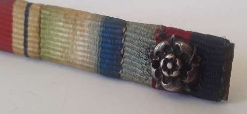 WW2 ribbon bar with silver rosette clasp. Pin intact.