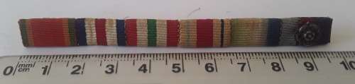 WW2 ribbon bar with silver rosette clasp. Pin intact.