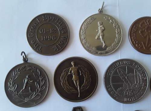 Collection of various vintage running medals.  1 bid takes all!