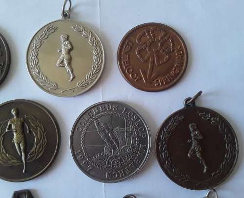 Collection of various vintage running medals.  1 bid takes all!
