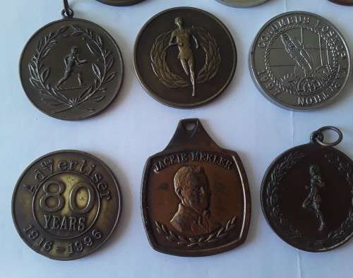 Collection of various vintage running medals.  1 bid takes all!