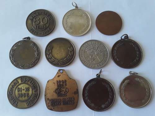 Collection of various vintage running medals.  1 bid takes all!