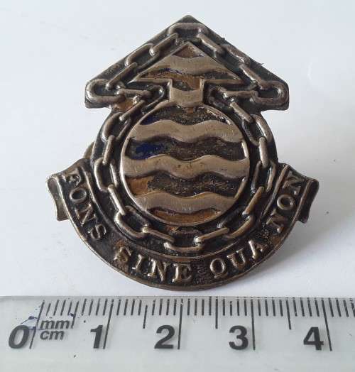 South Africa Ordnance Corps Cap Badge. Lugs intact.