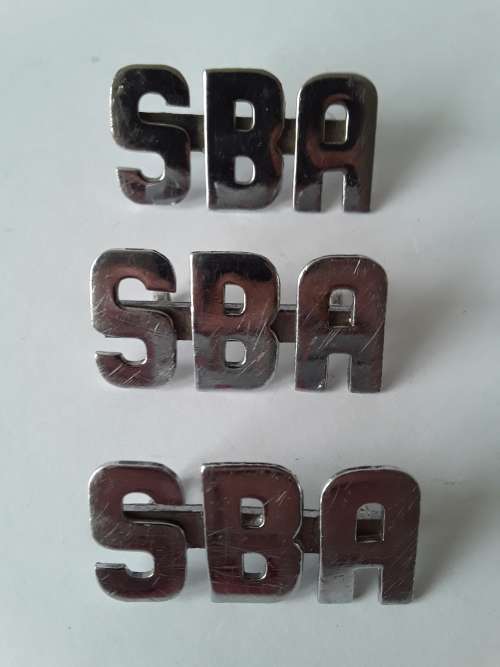 3 x SBA metal shoulder titles. Lugs intact.