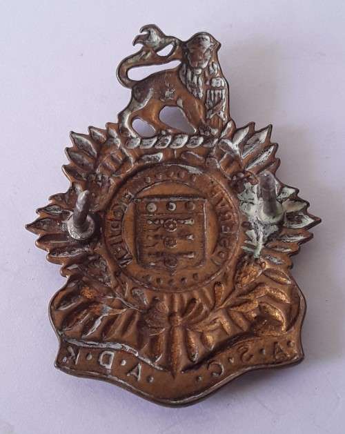 South African Army Service Corps `ASC/ADK` collar badge. Pins intact.