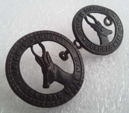 2 x SA Army `Union is Strength` Badges. Lugs intact.