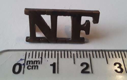 Early `Northumberland Fusiliers` Brass Shoulder Title. Lugs intact.