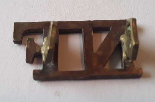 Early `Northumberland Fusiliers` Brass Shoulder Title. Lugs intact.