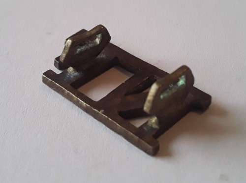 Early `Northumberland Fusiliers` Brass Shoulder Title. Lugs intact.