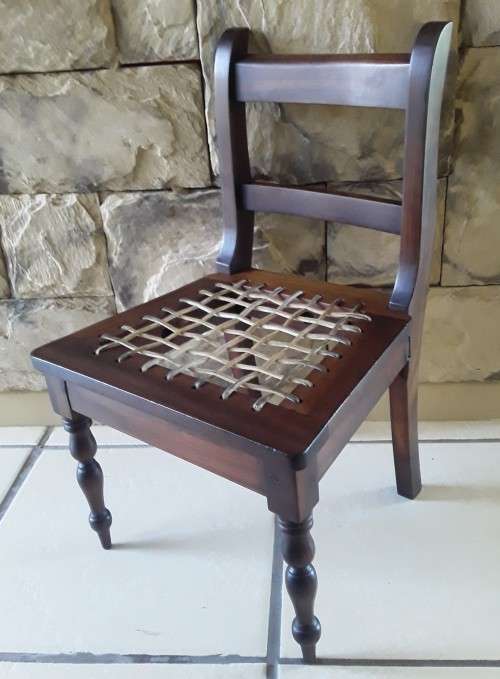 "Reserved". Superb Antique Cape Stinkwood Child`s Riempie Chair. 54,5 cm High.