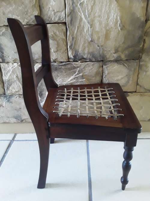 "Reserved". Superb Antique Cape Stinkwood Child`s Riempie Chair. 54,5 cm High.