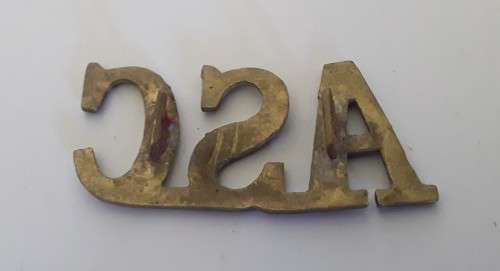 WW1 British Army Service Corps Brass Shoulder Title.  Lugs Intact.