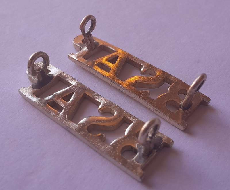 Pair Rhodesia BSAP (British South African Police) Shoulder Titles. Lugs intact.