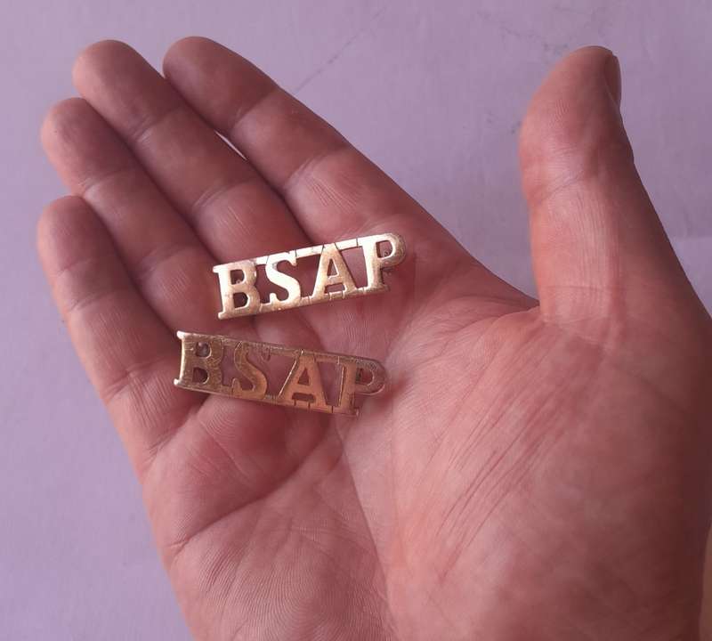 Pair Rhodesia BSAP (British South African Police) Shoulder Titles. Lugs intact.