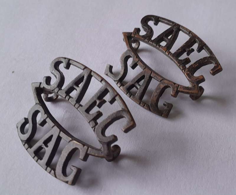 Pair SA Army Engineer Corps Dark Brass Titles. Lugs Intact.
