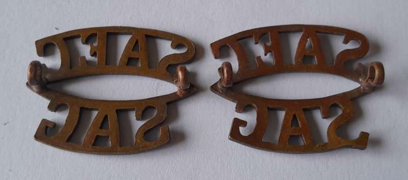 Pair SA Army Engineer Corps Dark Brass Titles. Lugs Intact.
